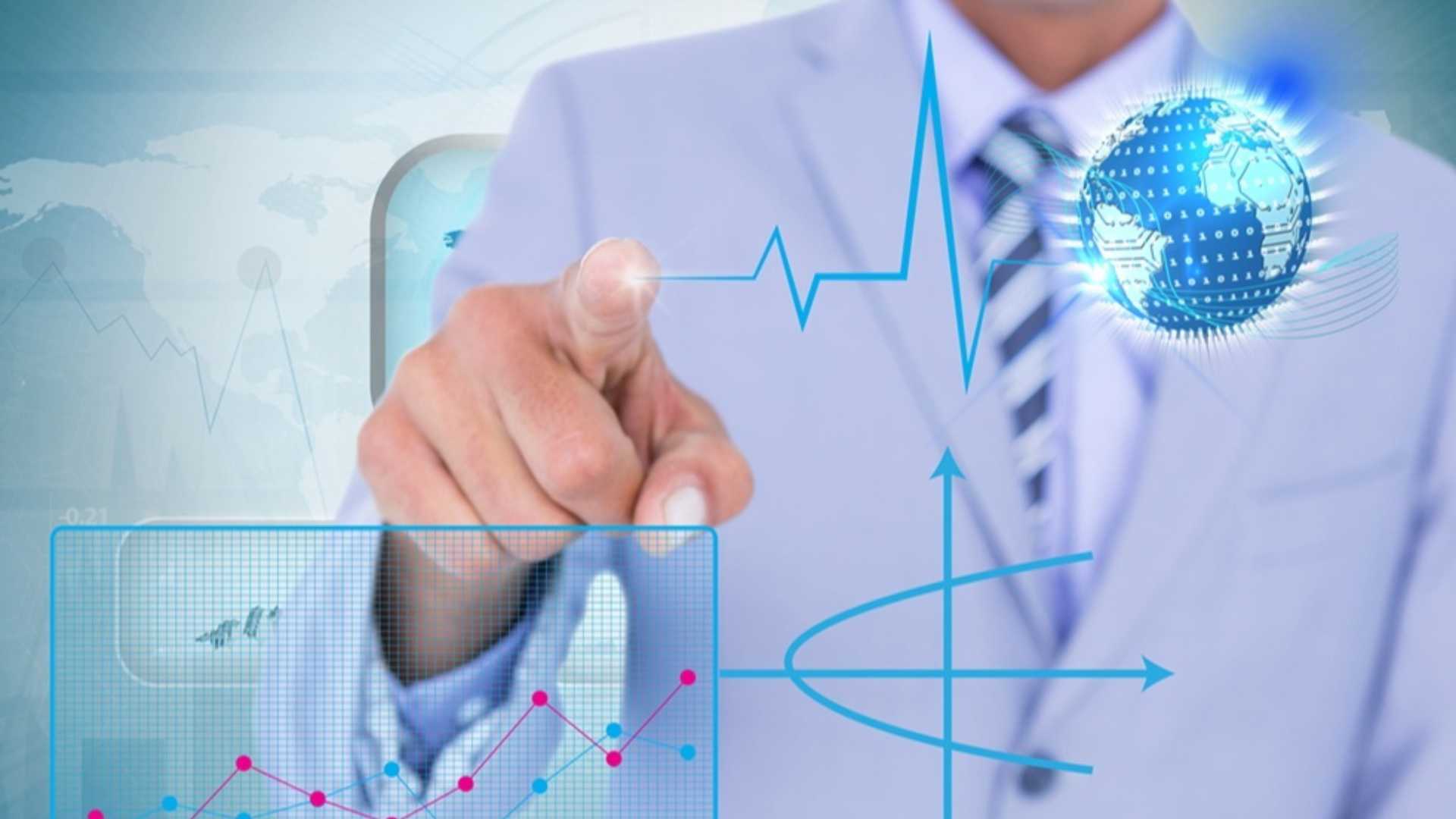 composite of businessman pointing at graphics